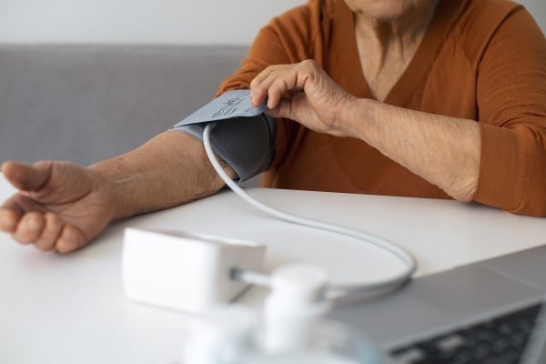 older-person-checking-their-blood-pressure-with-tensiometer
